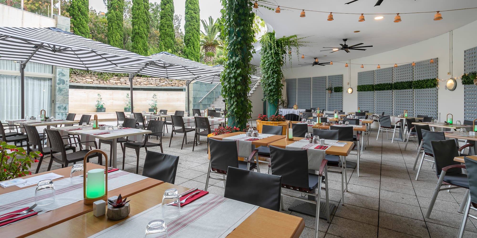 a large outdoor restaurant with tables and chairs