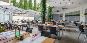 a large outdoor restaurant with tables and chairs