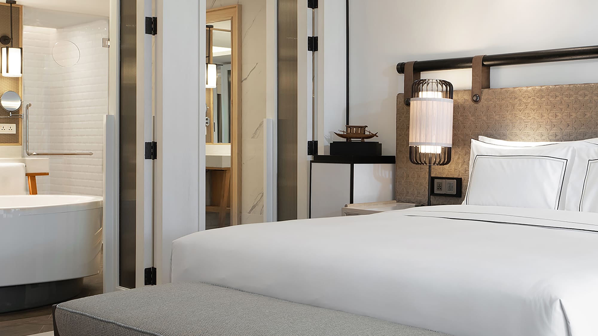 a bed and a bathtub in a hotel room