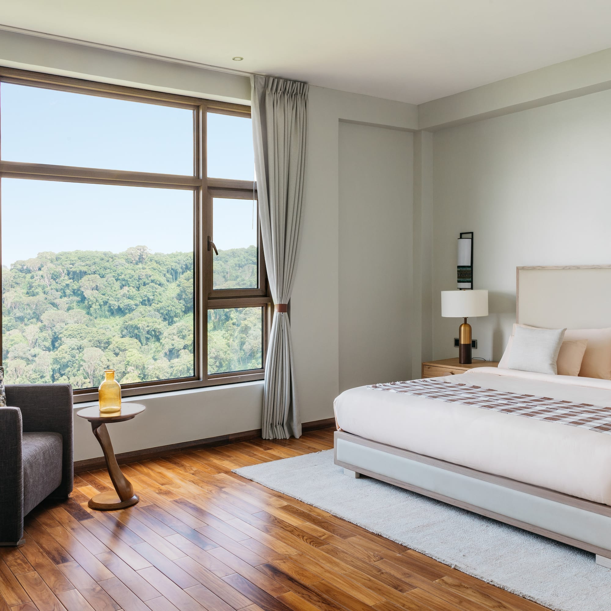 a bedroom with a large window