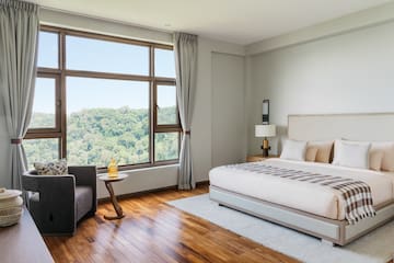 a bedroom with a large window