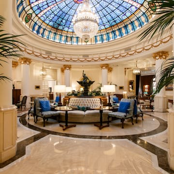 a room with a stained glass ceiling and a large round ceiling