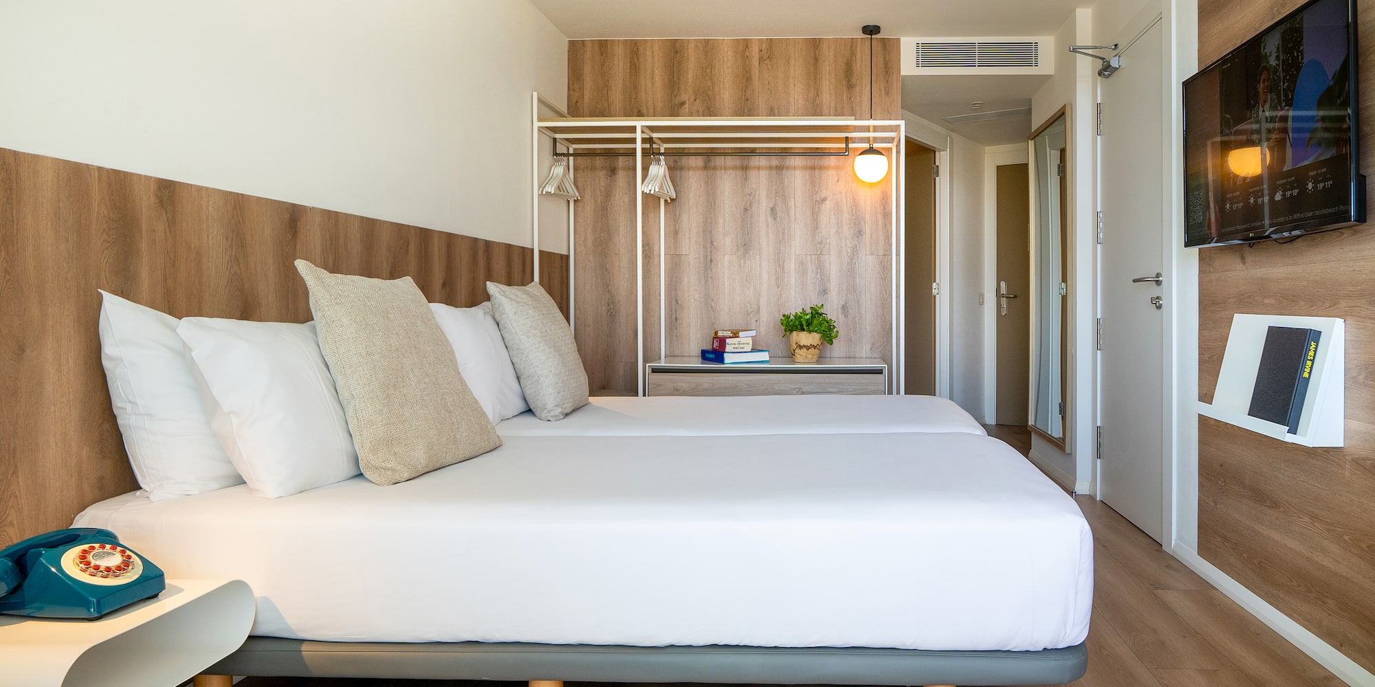 a bed with pillows in a room