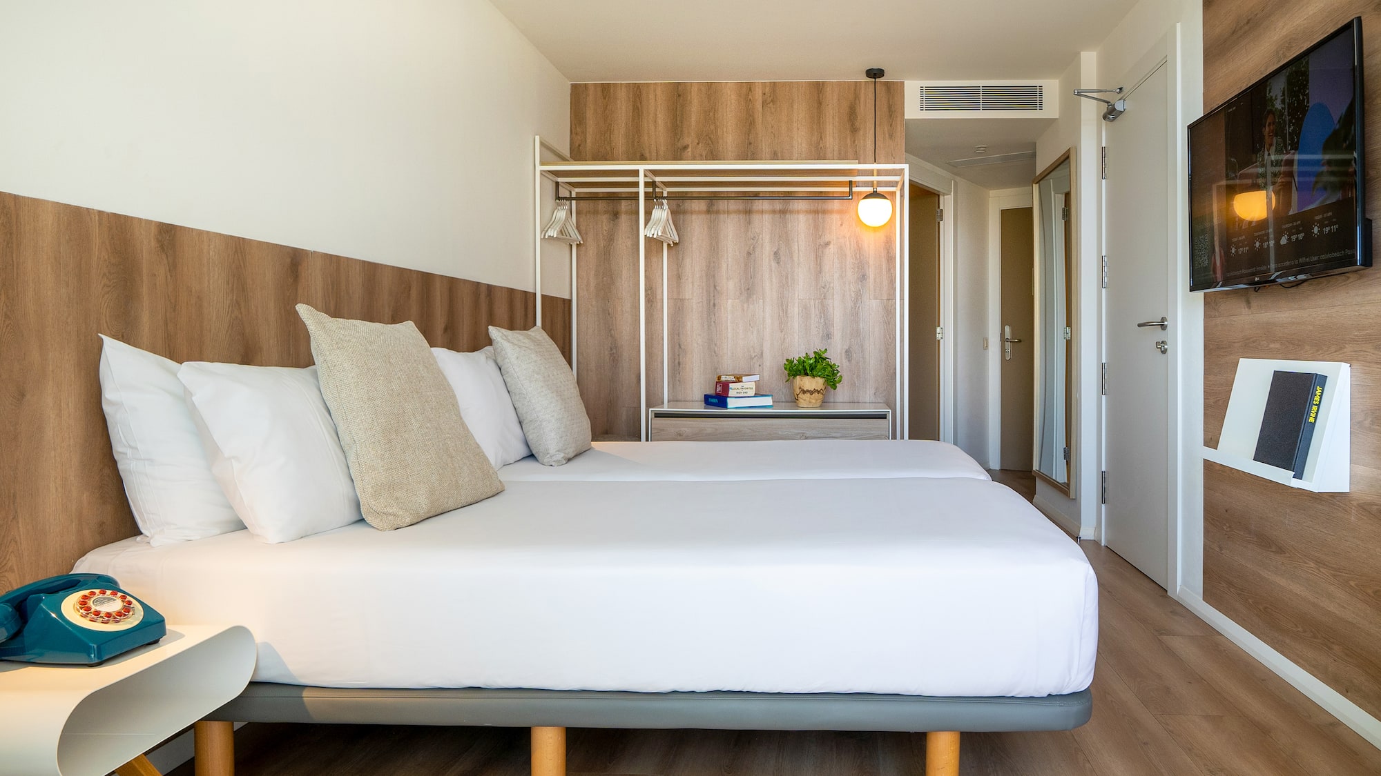 a bed with pillows in a room