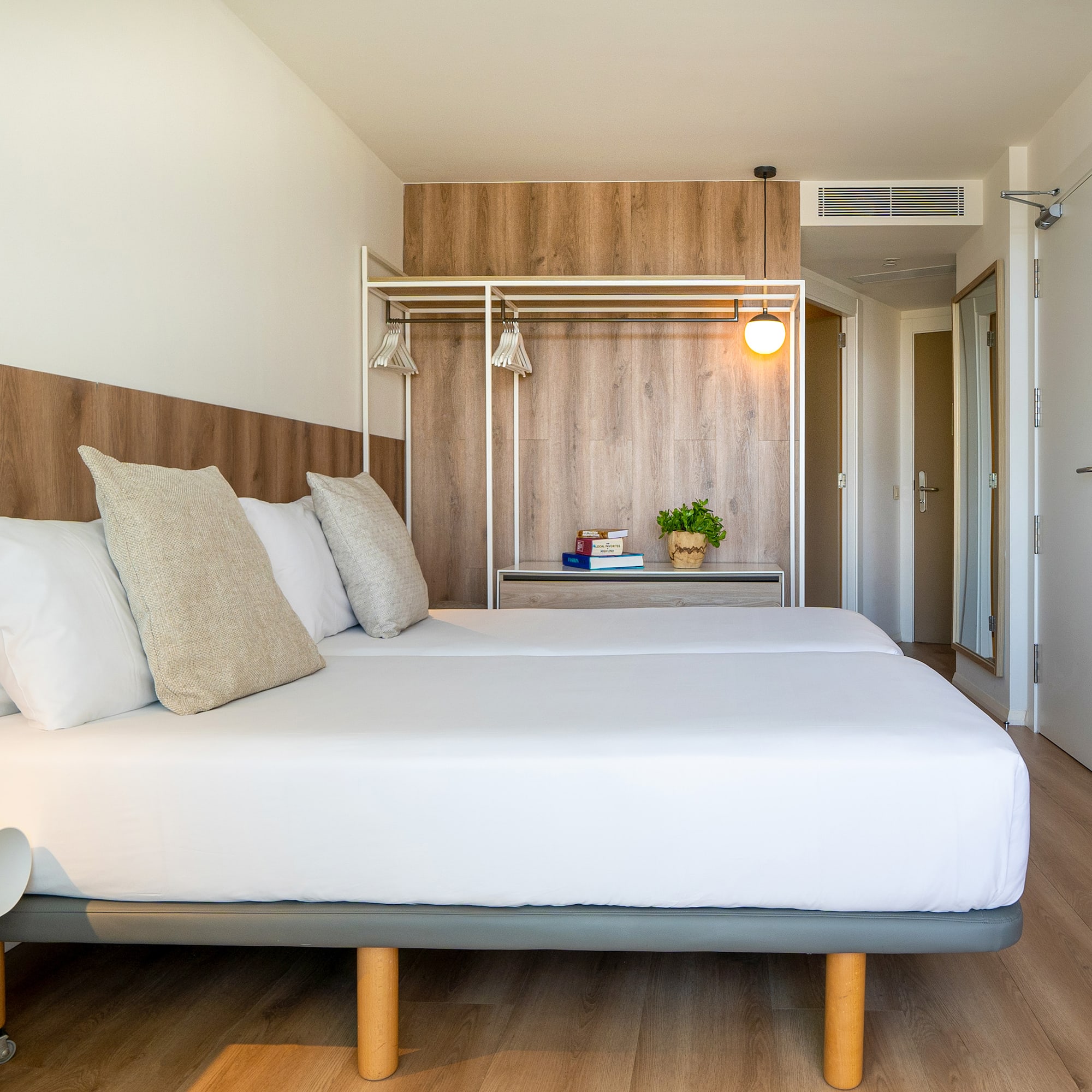 a bed with pillows in a room