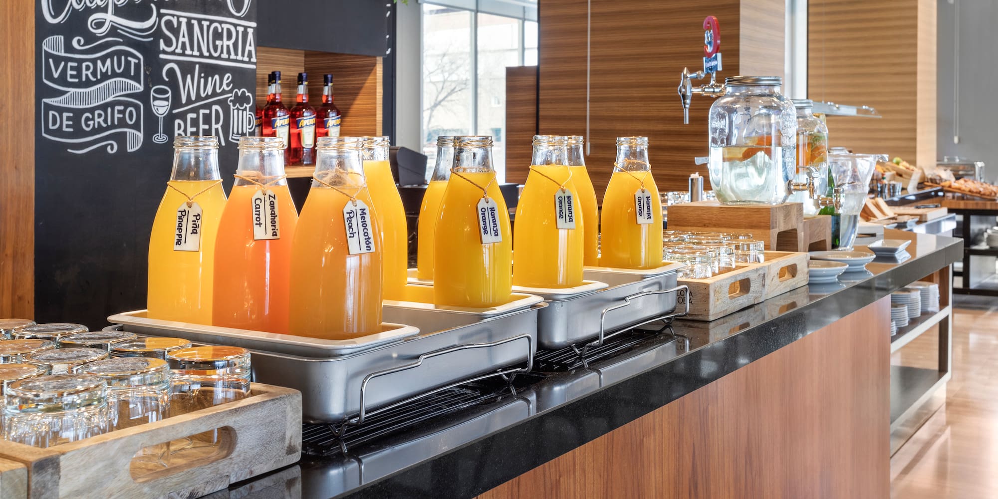 a row of bottles of orange juice