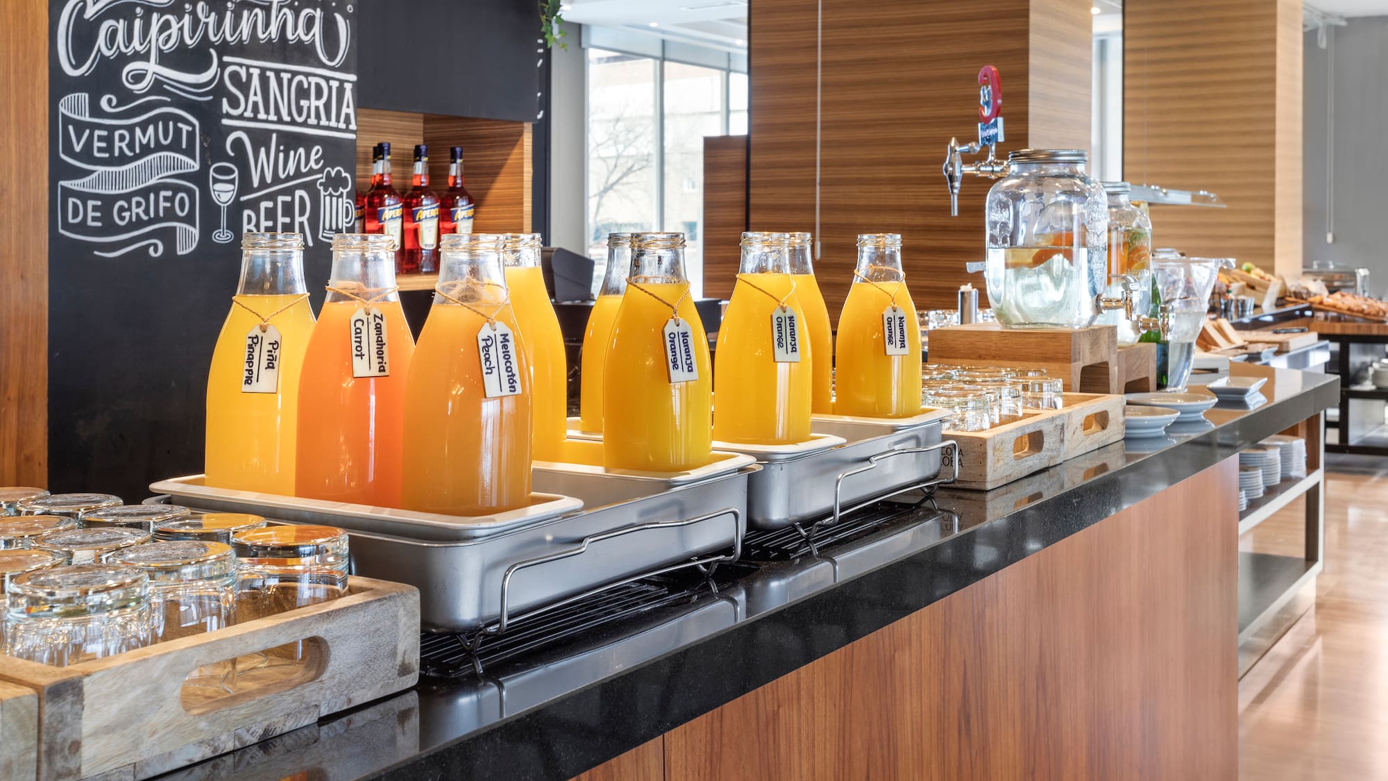 a row of bottles of orange juice