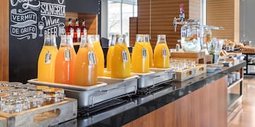a row of bottles of orange juice