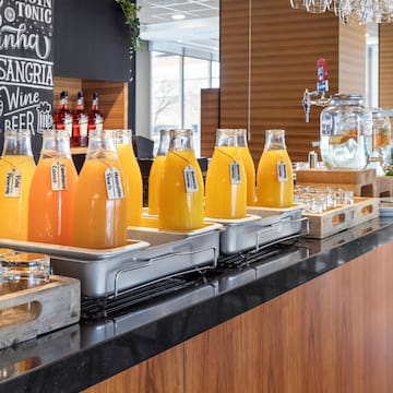 a row of bottles of orange juice