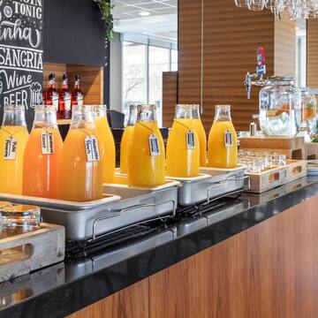 a row of bottles of orange juice