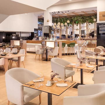 a restaurant with tables and chairs