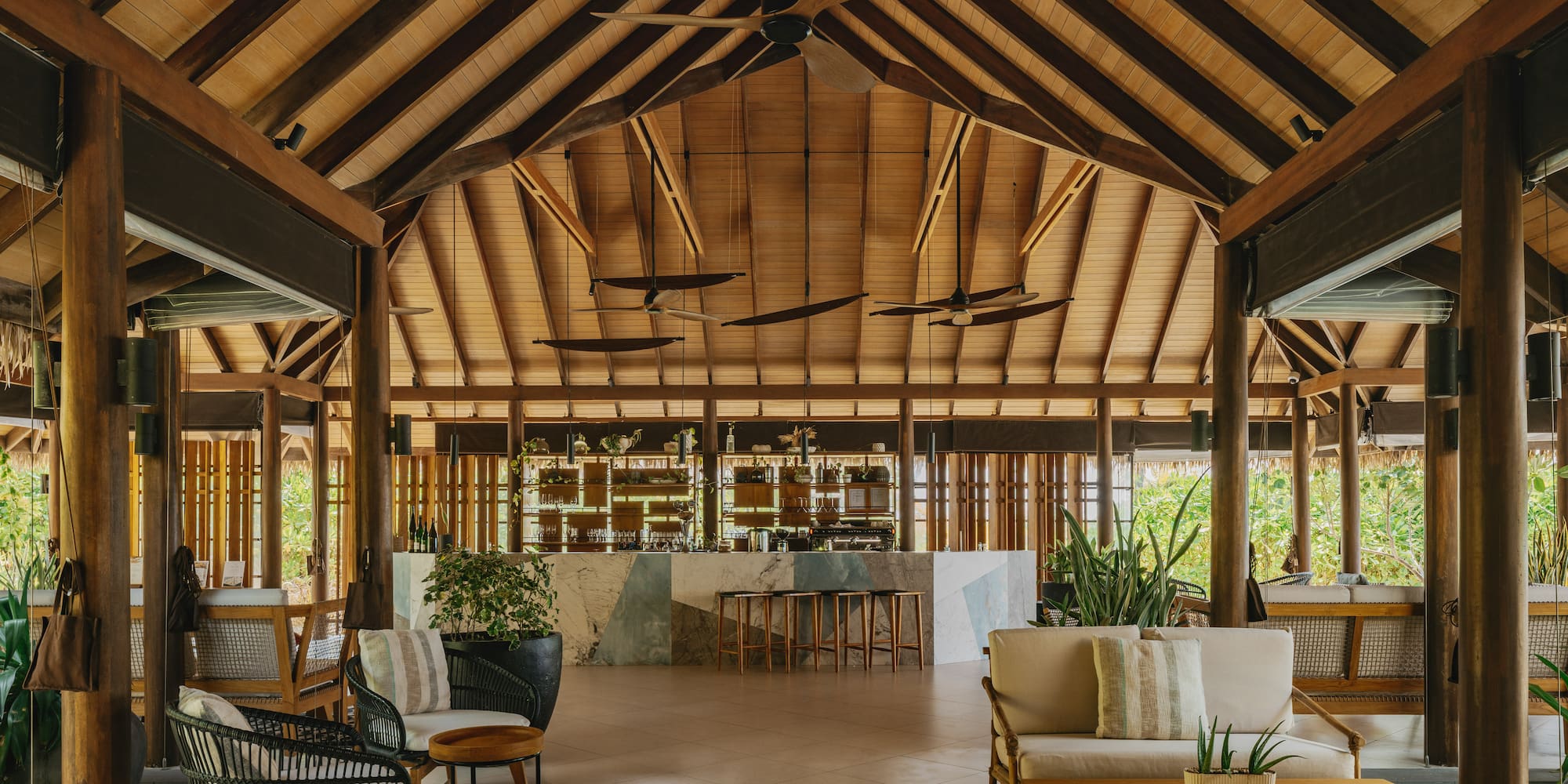 a room with a bar and chairs