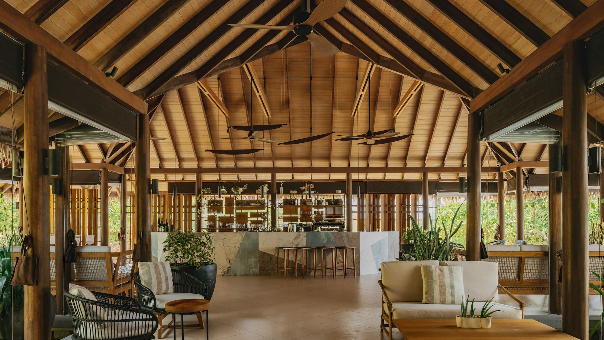 a room with a bar and chairs