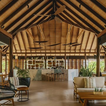 a room with a bar and chairs