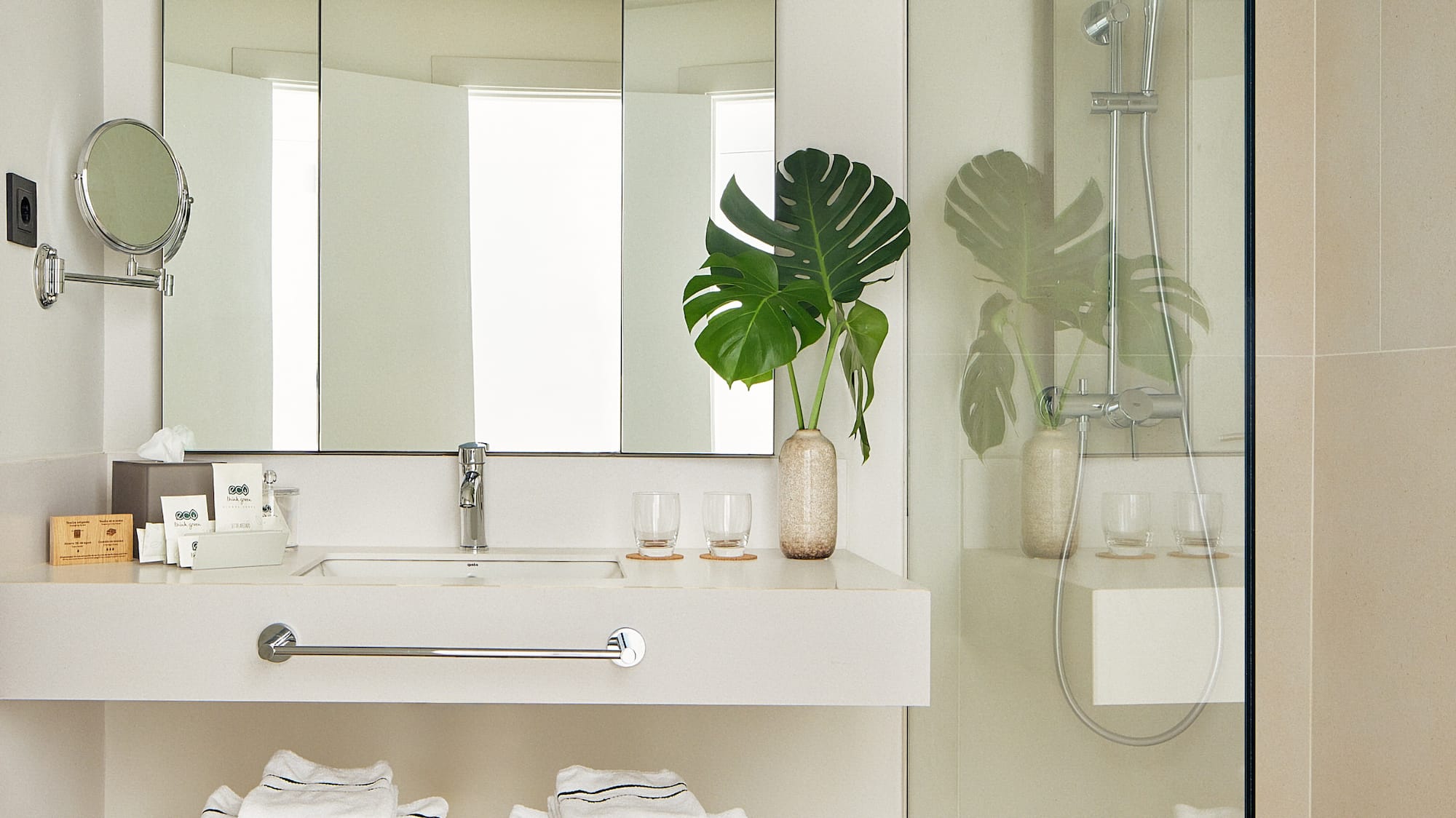 a bathroom with a mirror and a sink