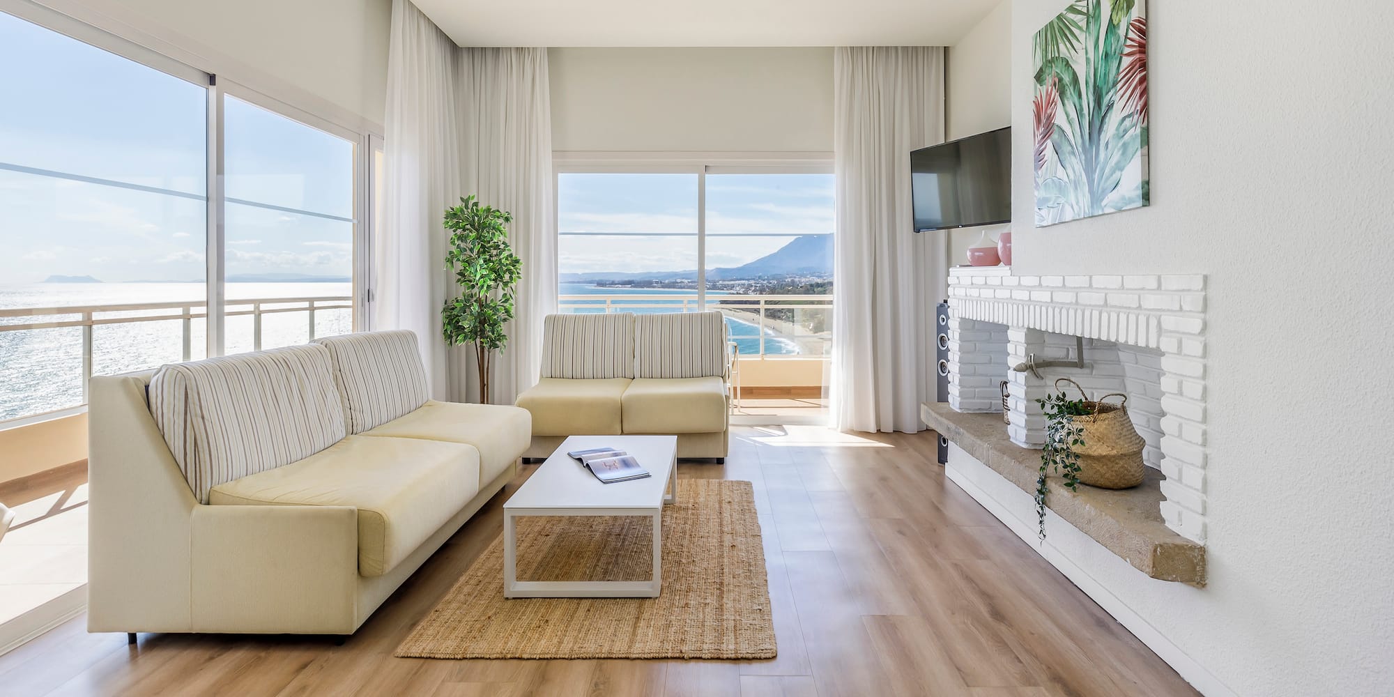a living room with a fireplace and couches
