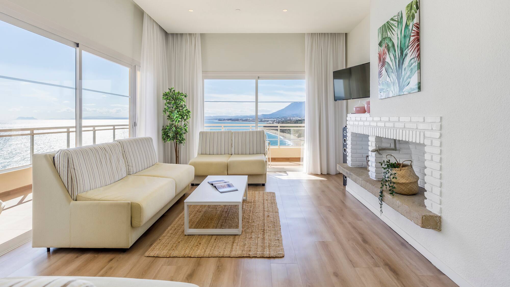 a living room with a fireplace and couches