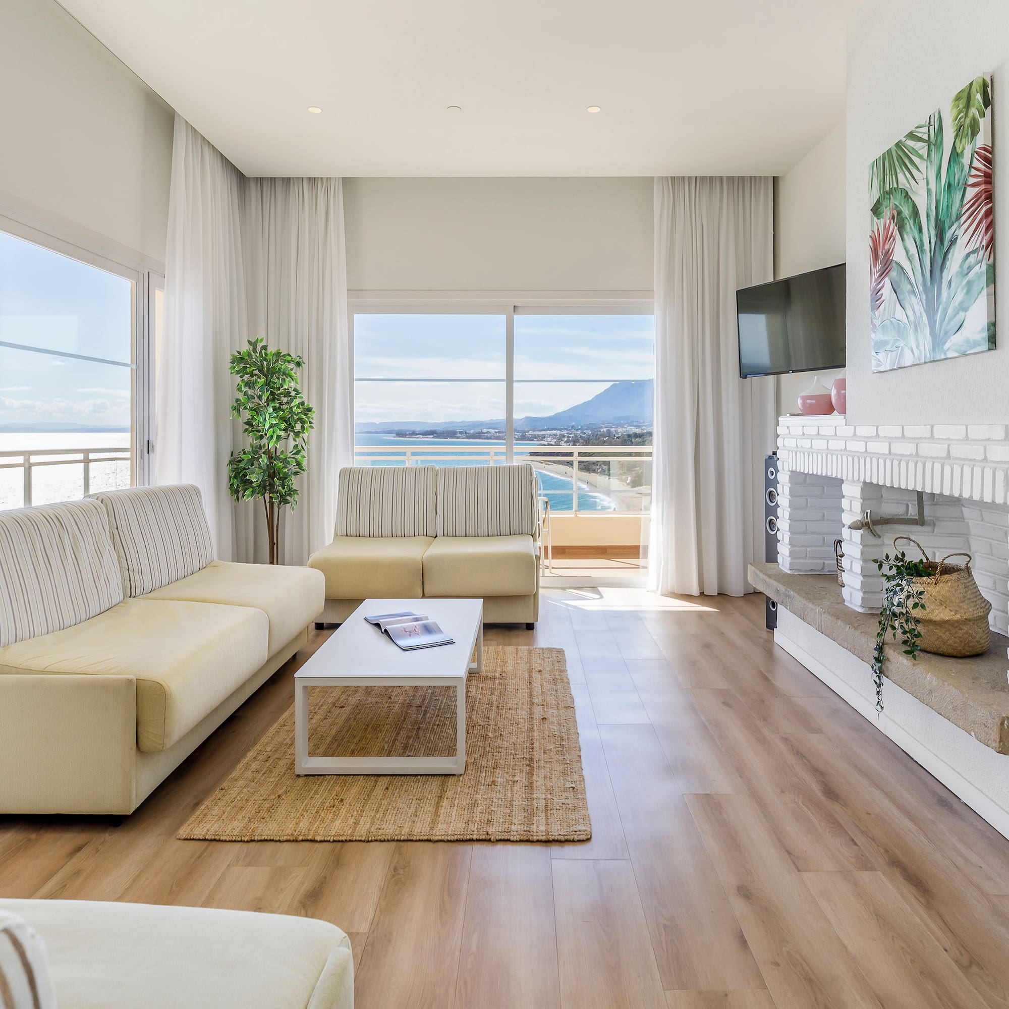 a living room with a fireplace and couches