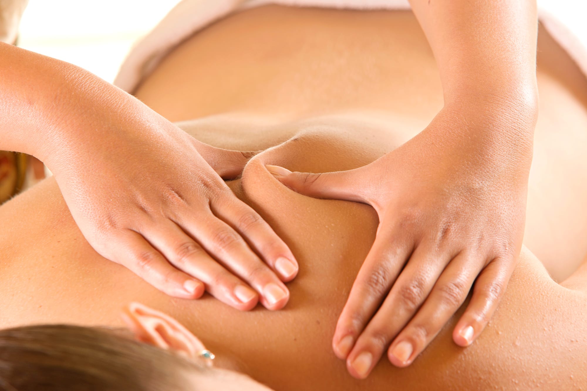 a woman receiving a back massage