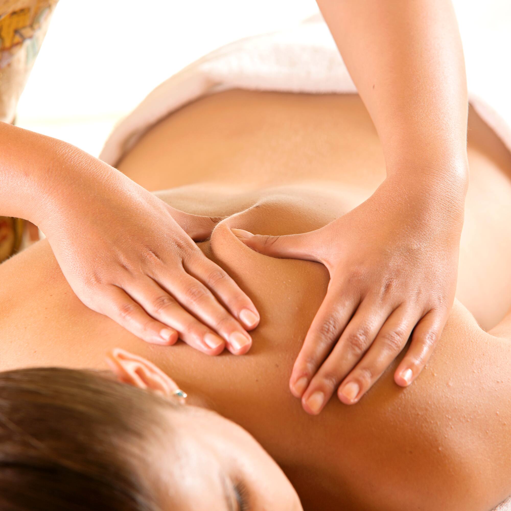a woman receiving a back massage