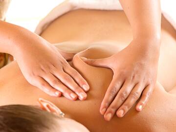 a woman receiving a back massage