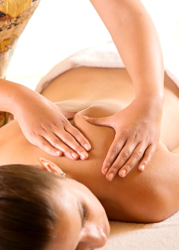 a woman receiving a back massage