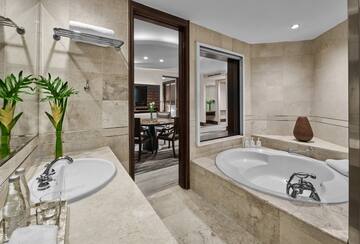 a bathroom with a tub and sink