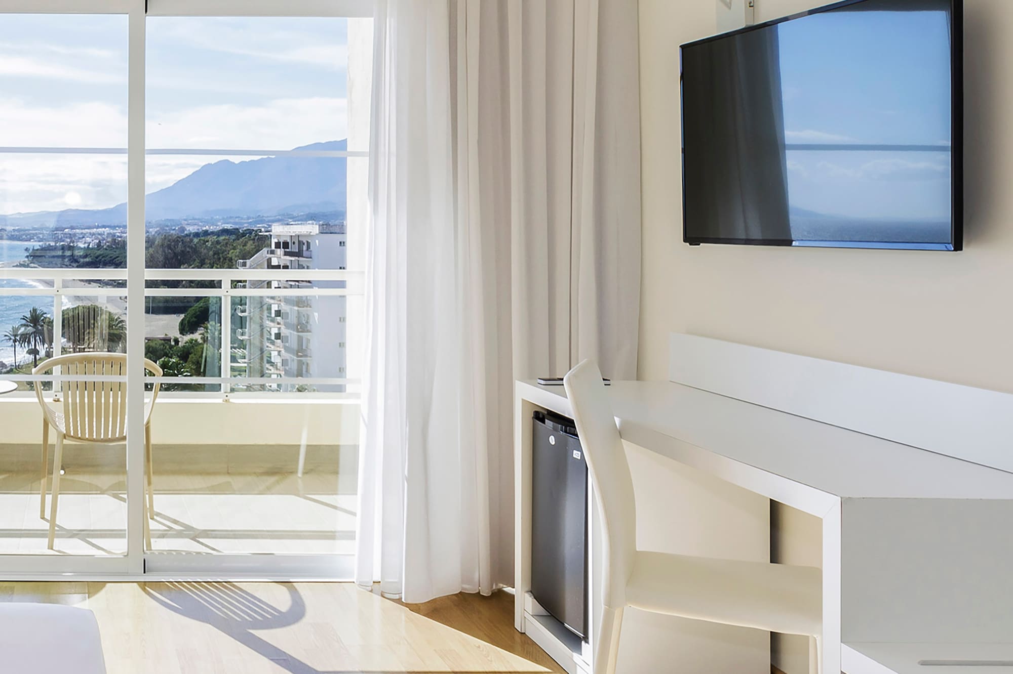 a room with a television and a table