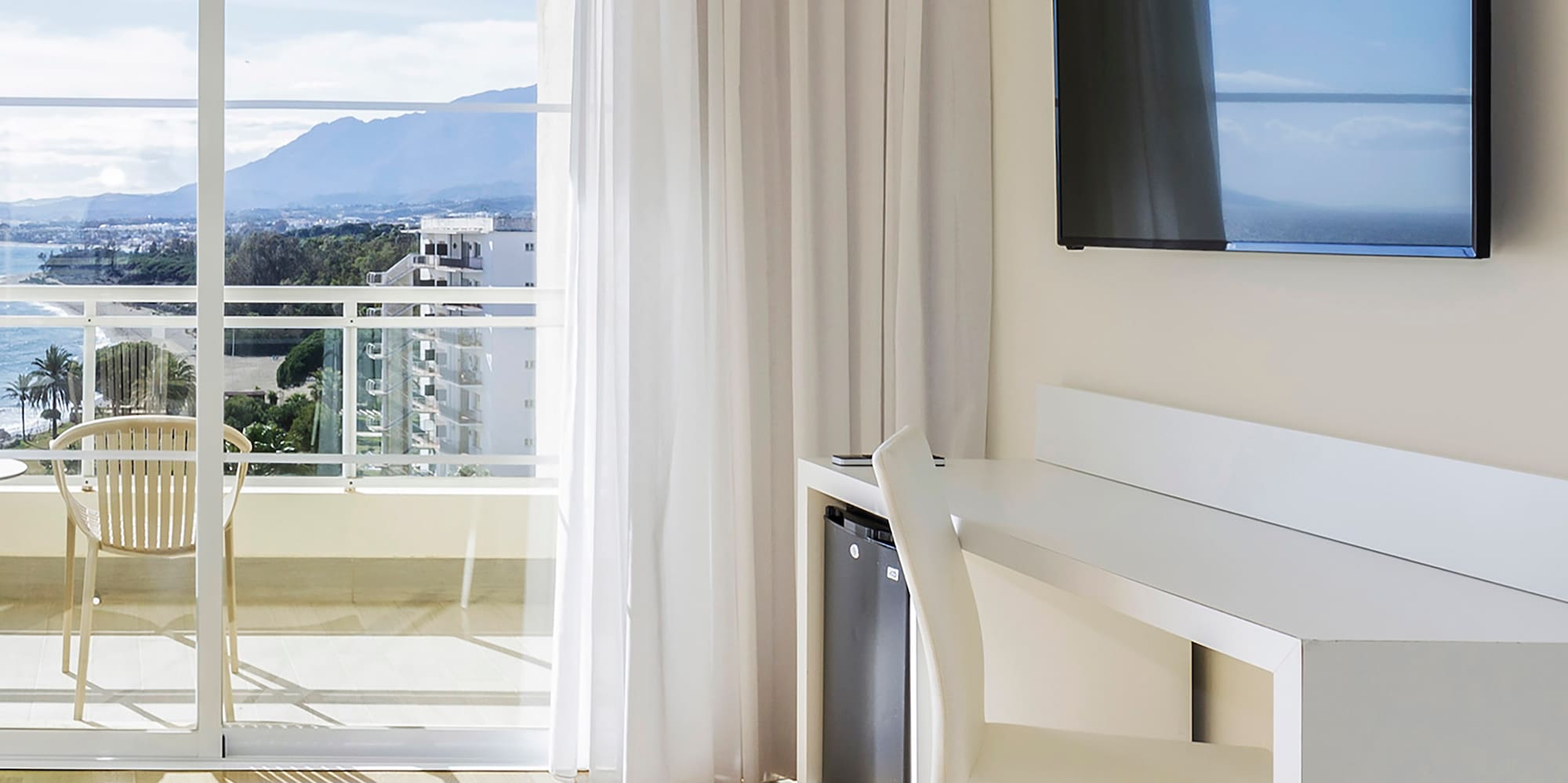 a room with a television and a table