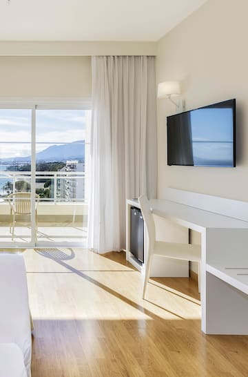 a room with a television and a table