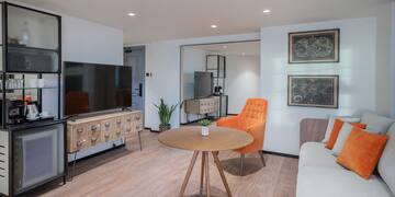 a room with a television and a chair