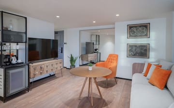 a room with a television and a chair