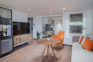 a room with a television and a chair