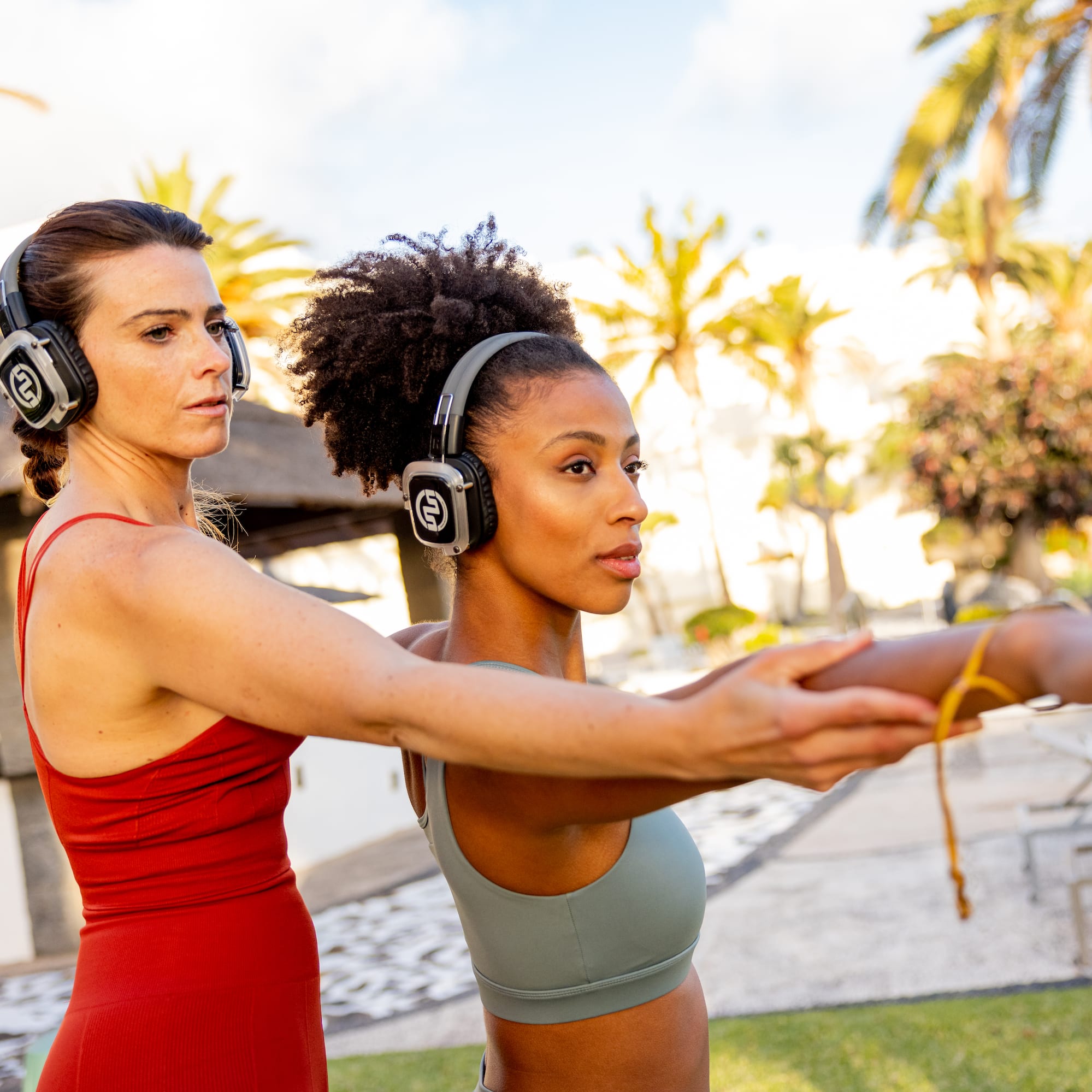 a woman stretching her arms with headphones