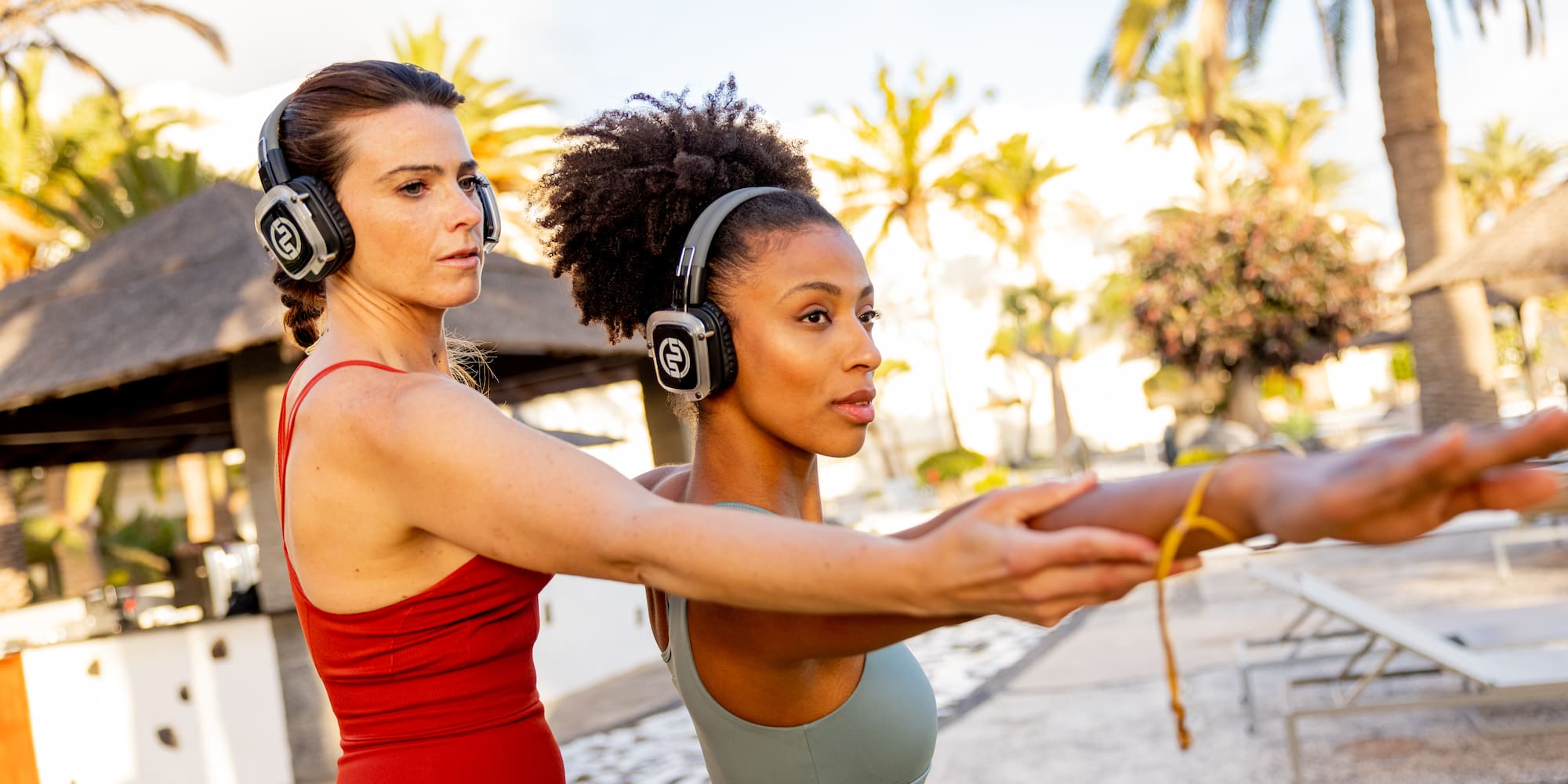a woman stretching her arms with headphones