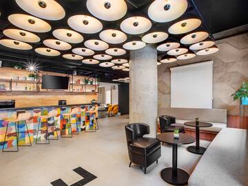 a room with a large ceiling and a large screen
