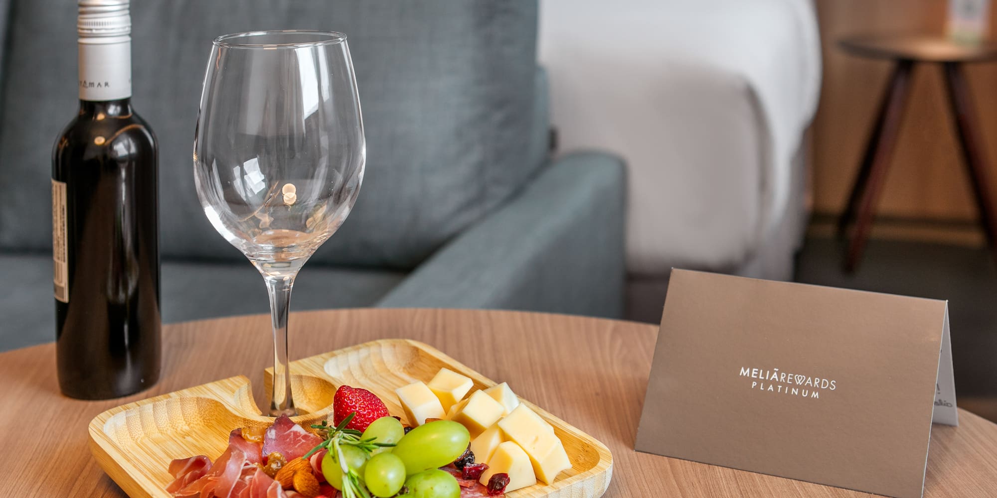 a plate of food and wine on a table