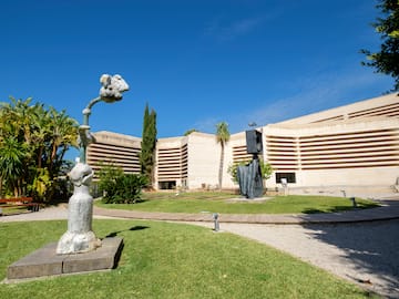 a statue in front of a building