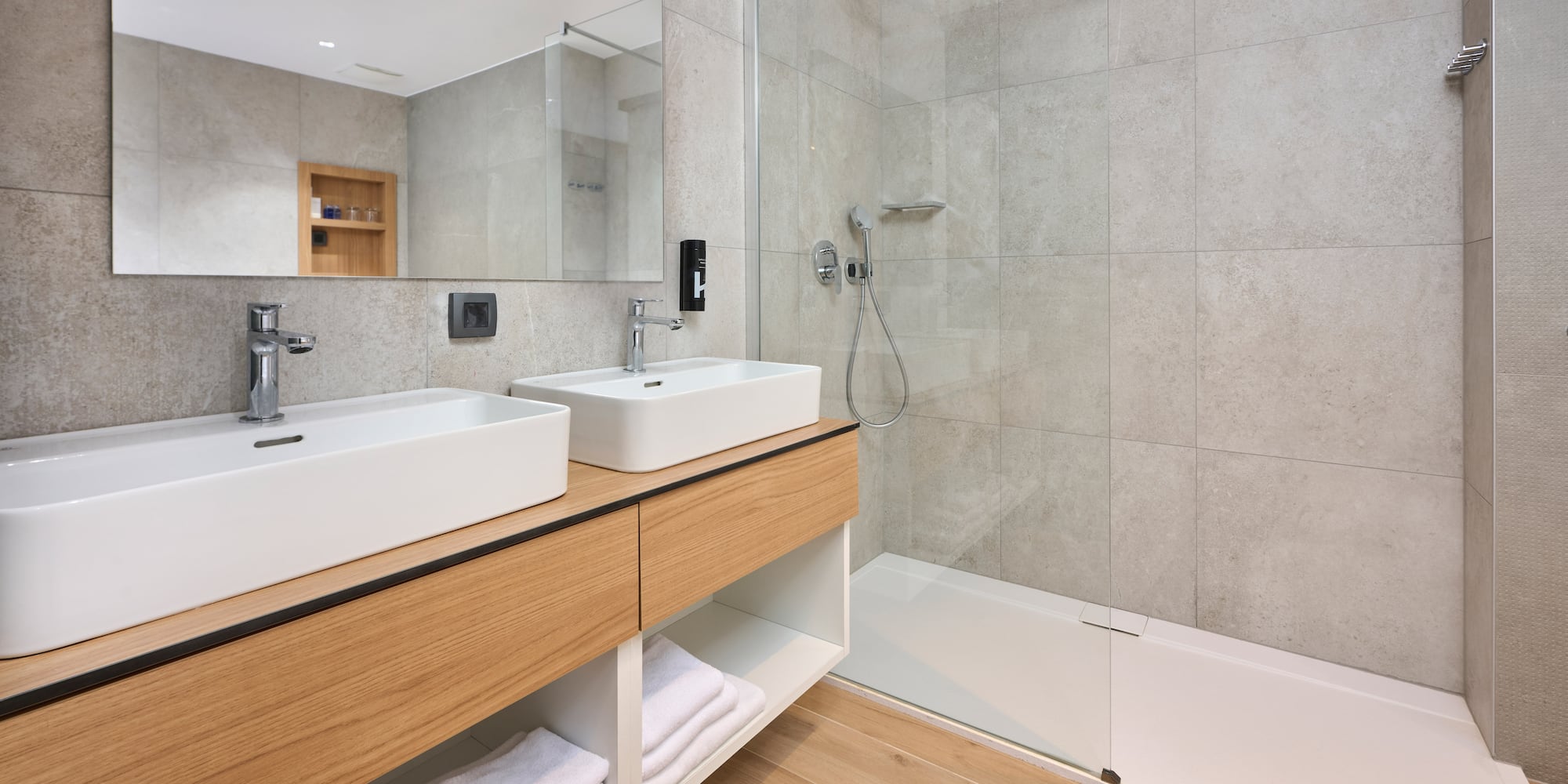 a bathroom with a shower and sink