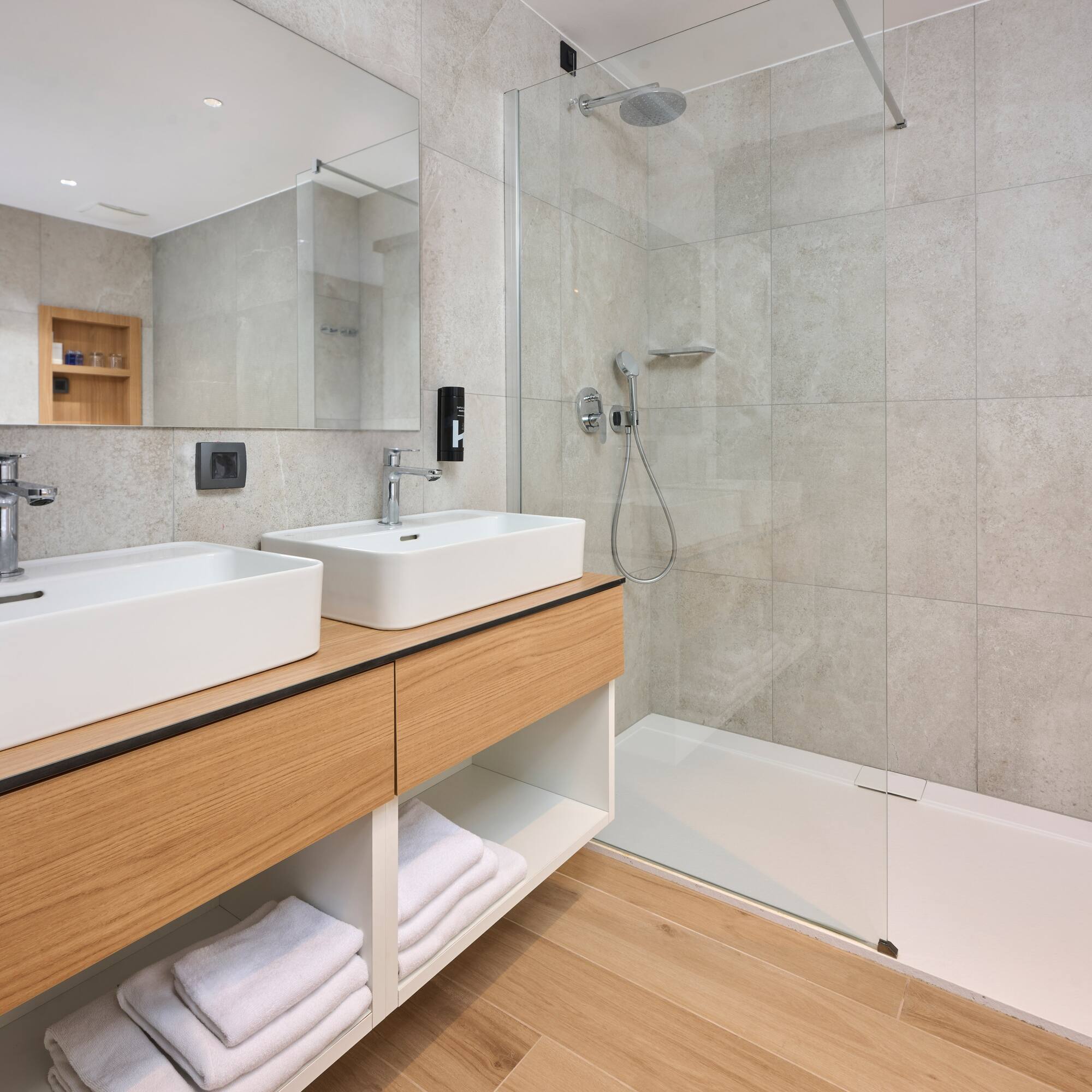 a bathroom with a shower and sink