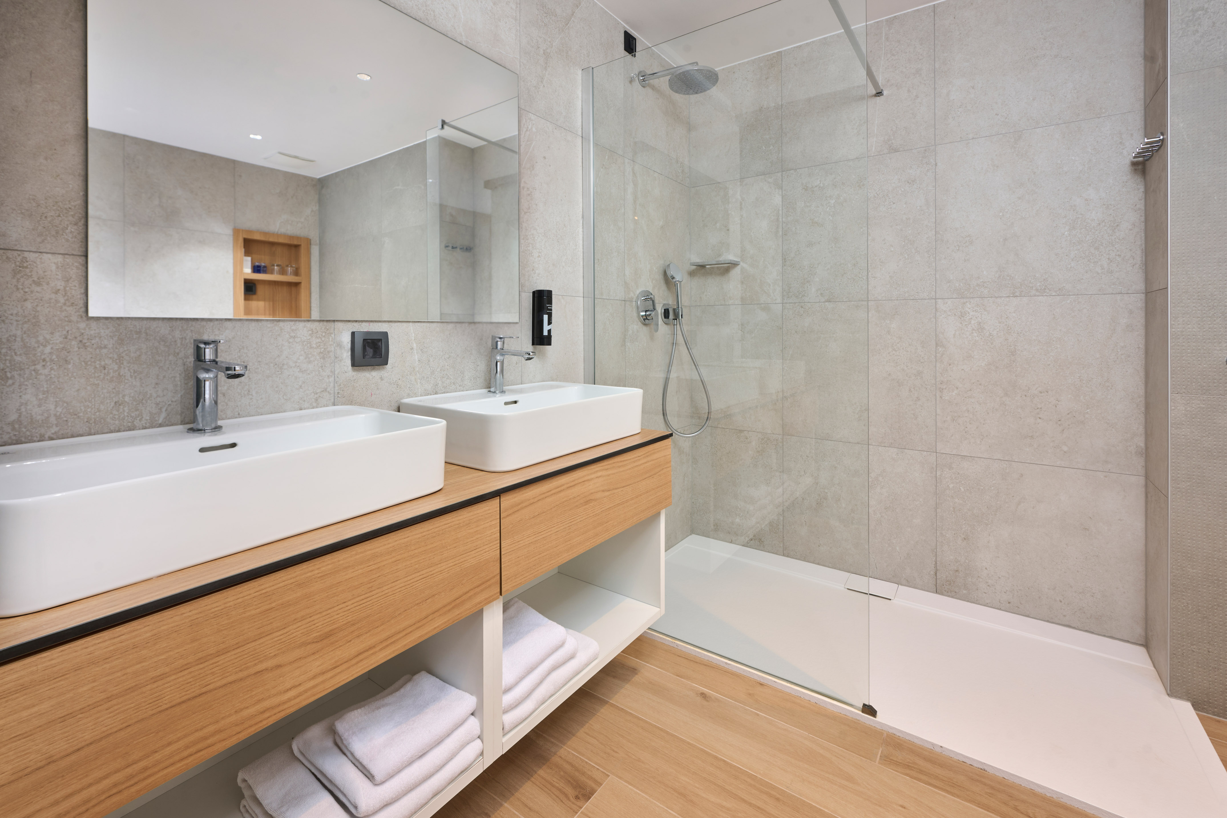 a bathroom with a shower and sink