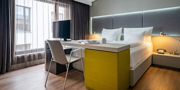 a room with a bed and a desk