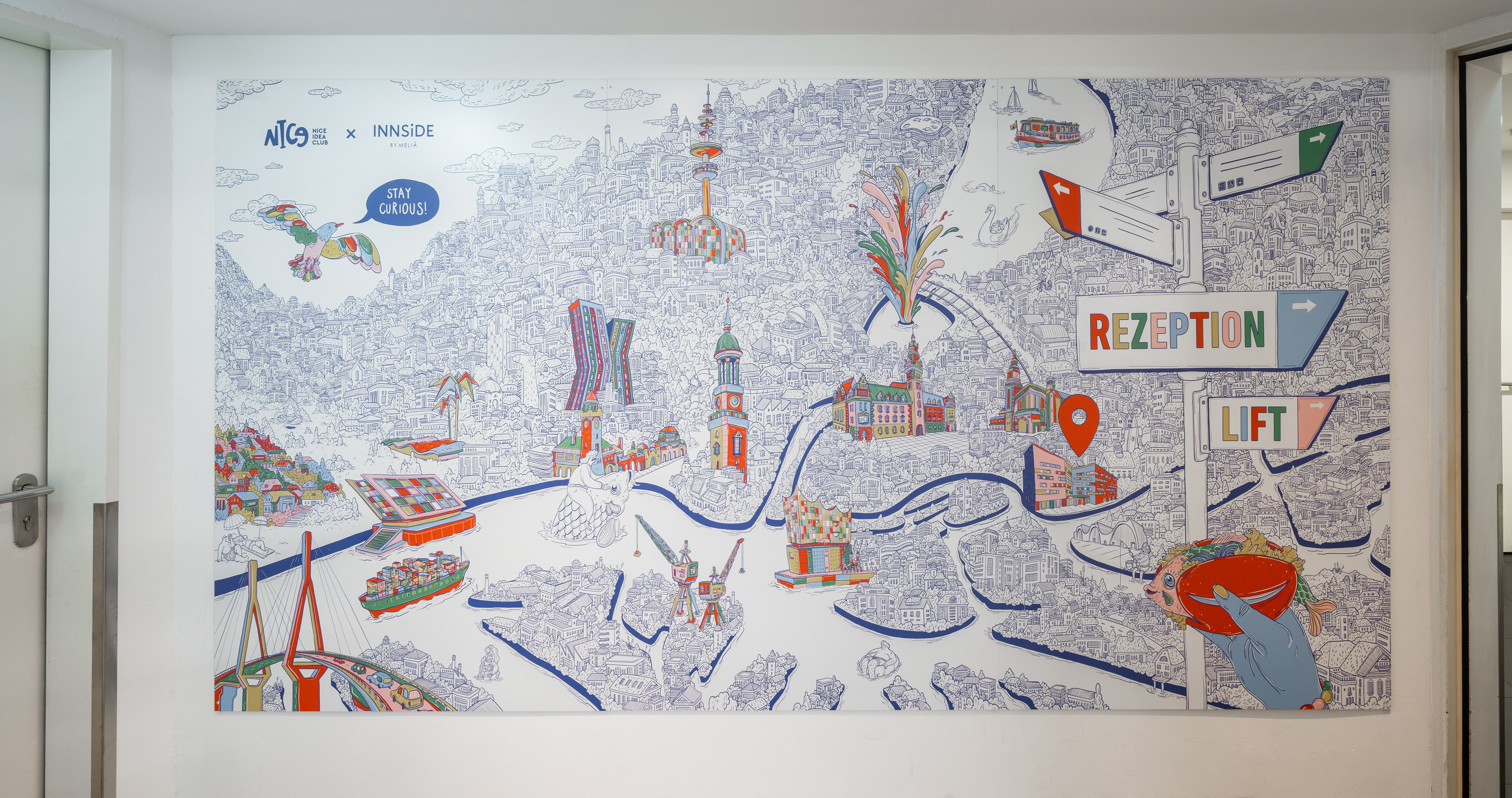 Whimsical hotel city map mural showing reception and lift directions.