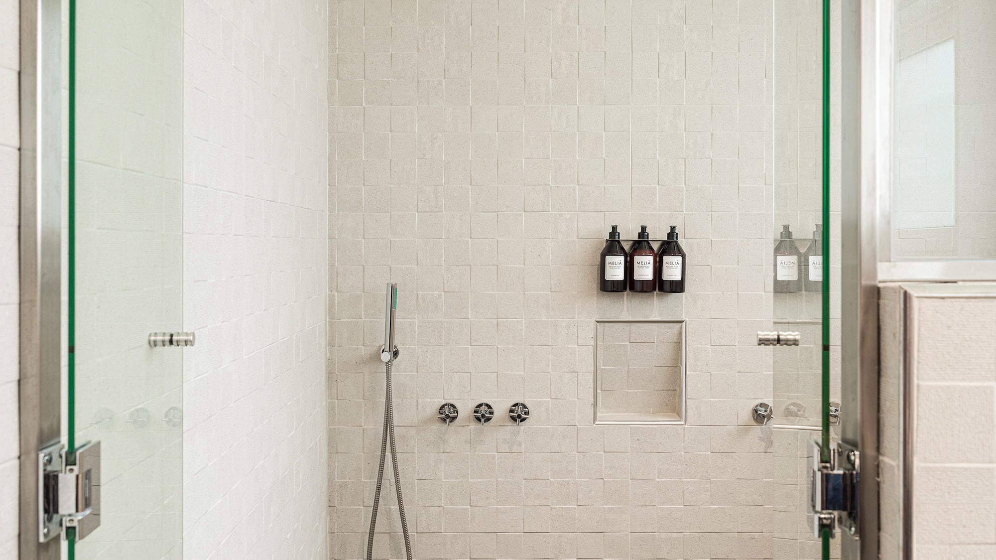 a shower with glass doors