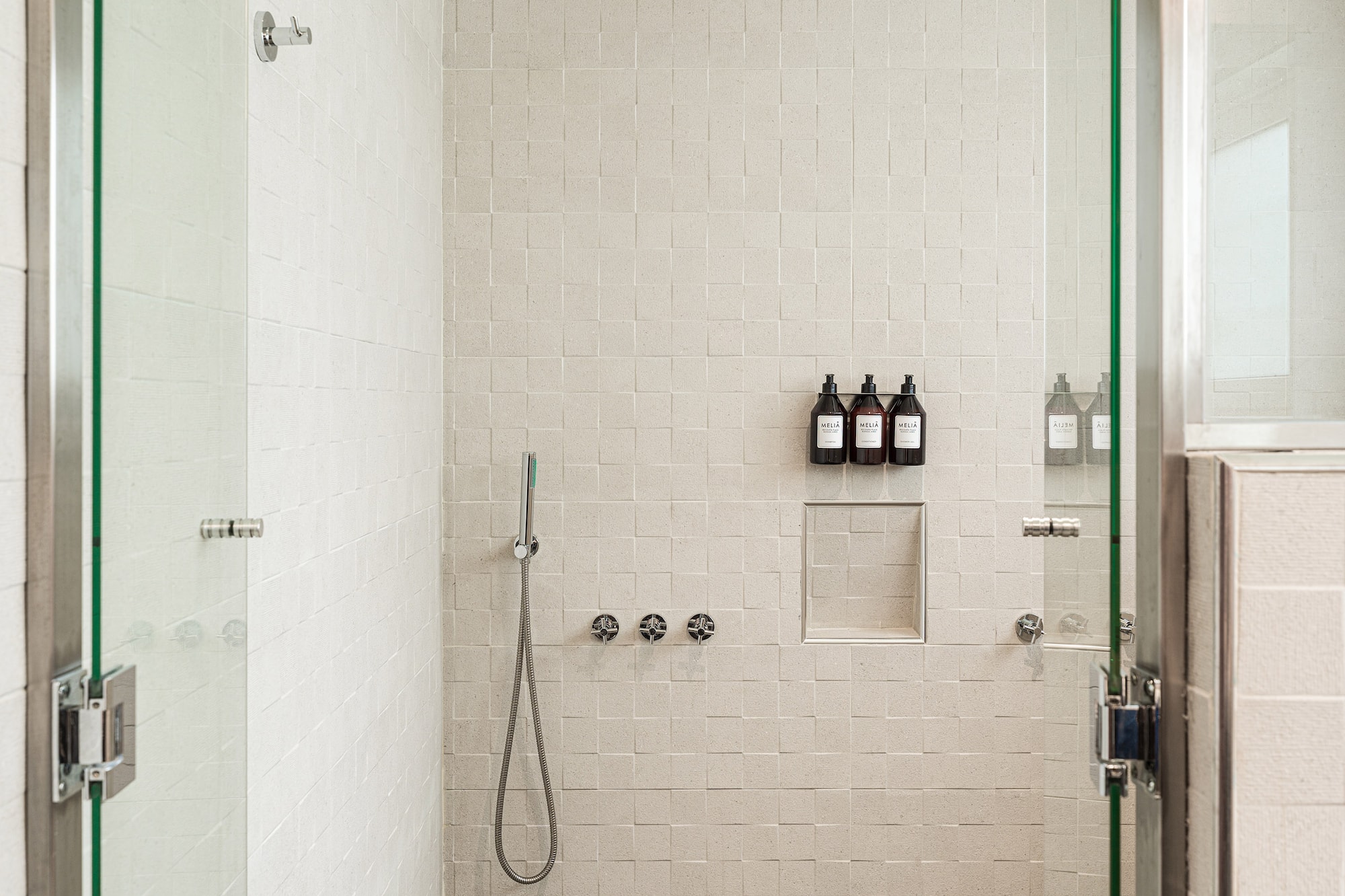 a shower with glass doors