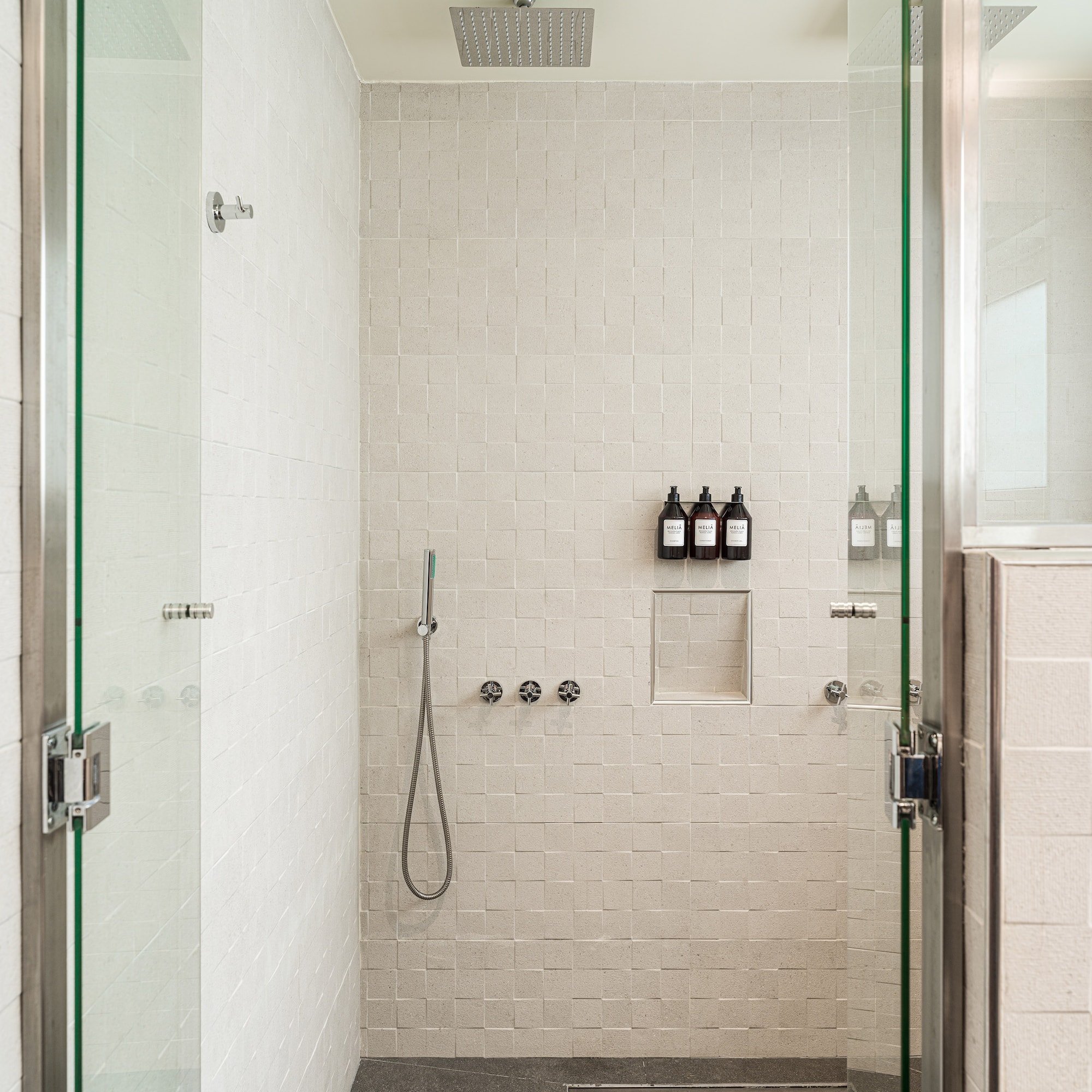 a shower with glass doors
