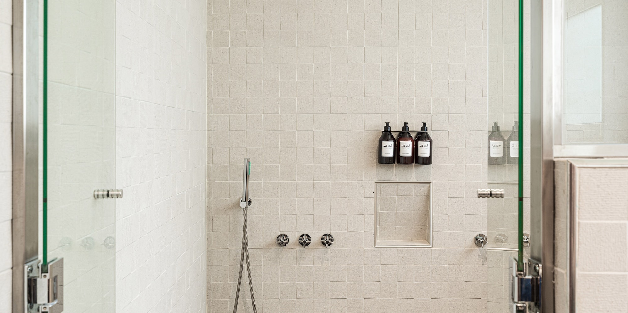 a shower with glass doors