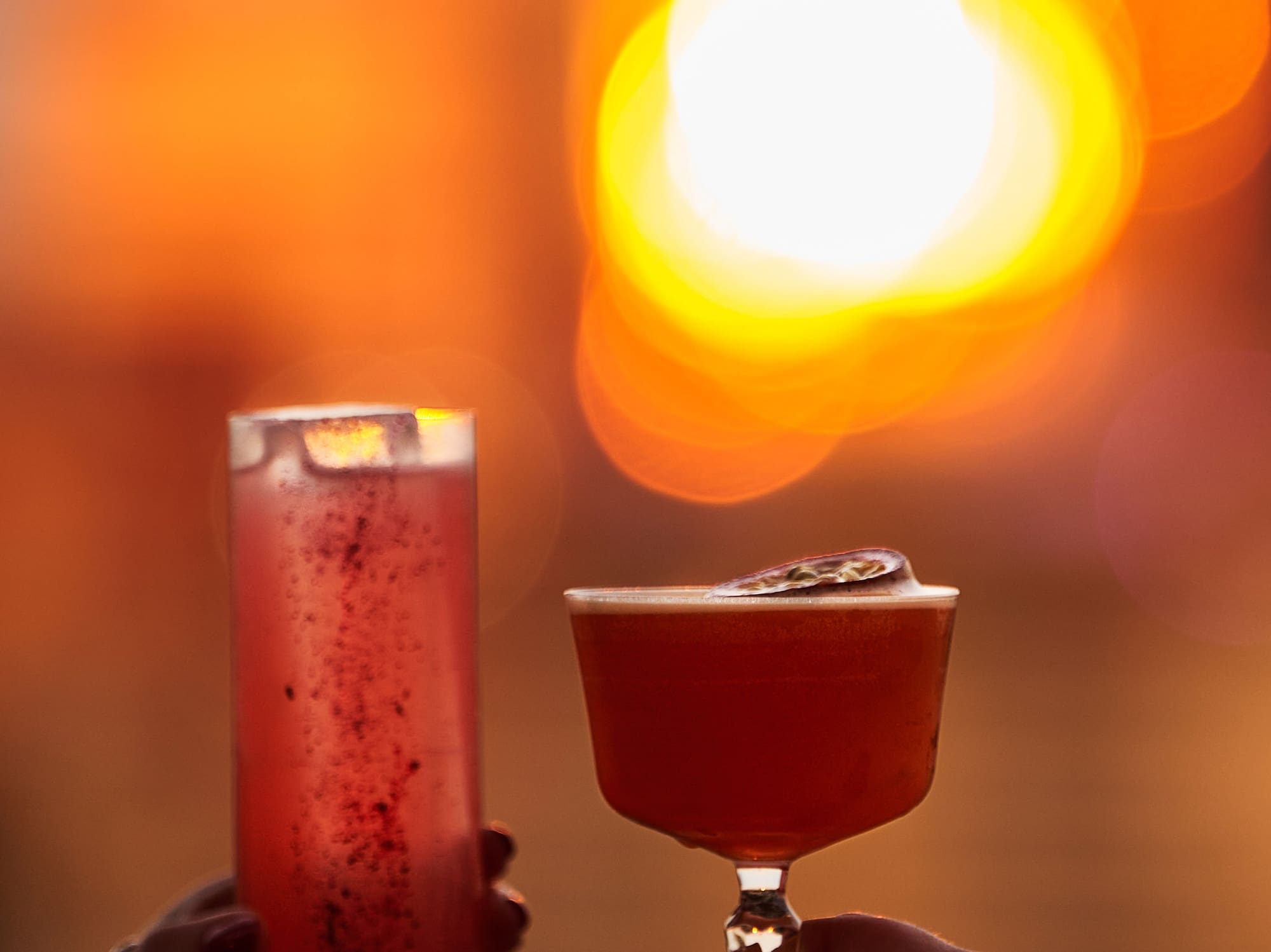 a man and woman walking in a forest