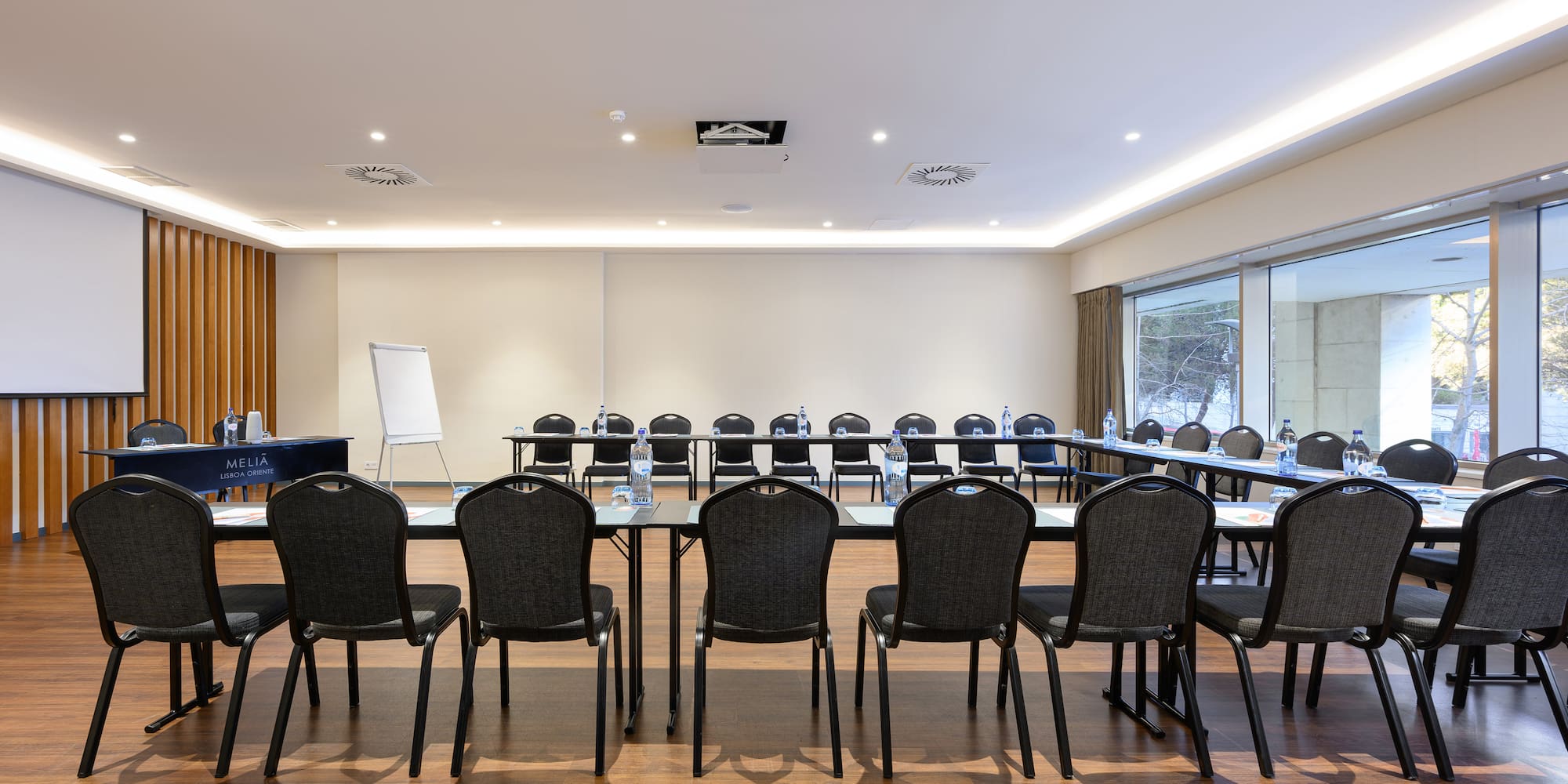 a room with a large table and chairs