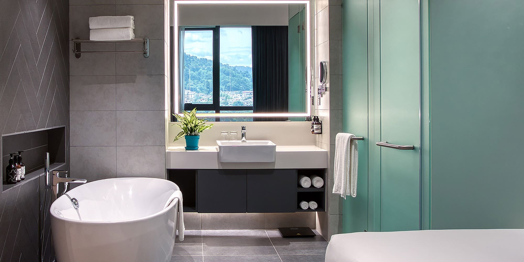 a bathroom with a tub and a sink